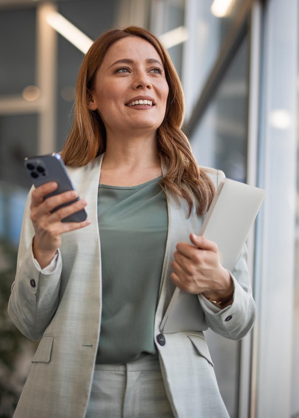 businesswoman looking up and smiling