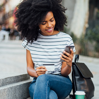 Happy woman looking at phone