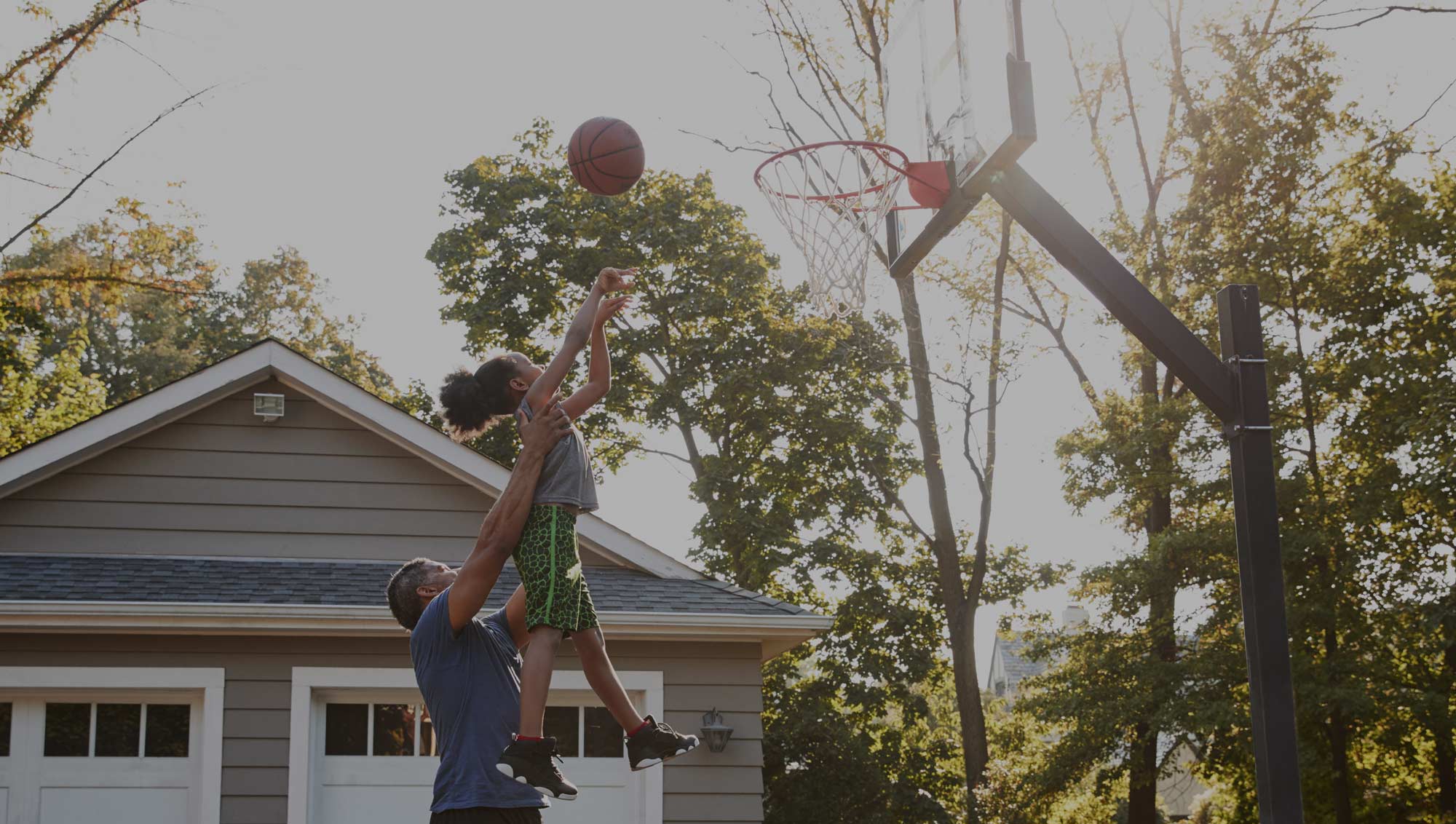 Father and daughter playing basketball