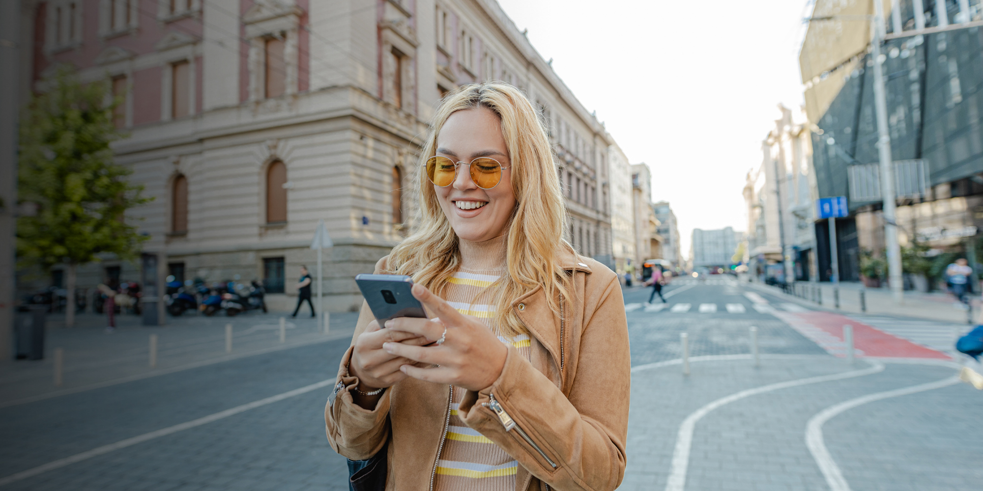 woman looking at her phone while outside