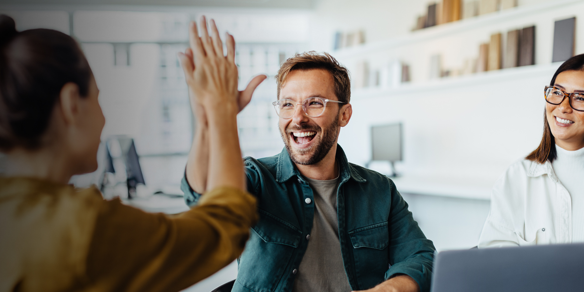 Man and woman high-fiving